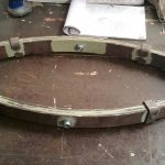 Suspension à double pincettes pour calèche